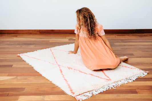 Beni Ourain tribal rug knot weaved handmade in Morocco and featuring symmetrical soft pink lozenge pattern. 