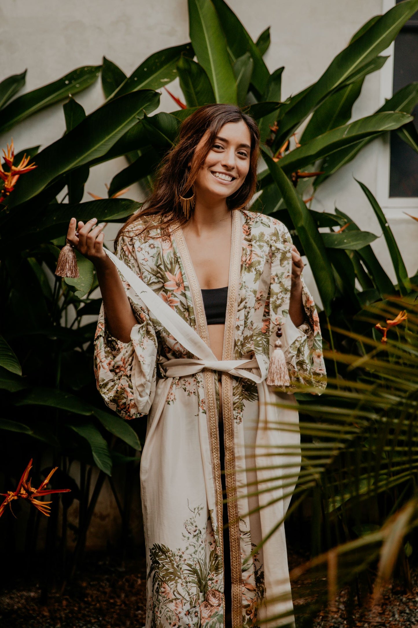 This summer white kimono with floral print is gorgeous. We love the retro style of the puffy sleeves. The neckline is enhanced by an elegant handwoven golden silk trim