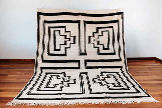 Moroccan kilim rug, handmade in Morocco, flat weaved, white base with black abstract geometric designs, made using organic sheep wool from the atlas mountains