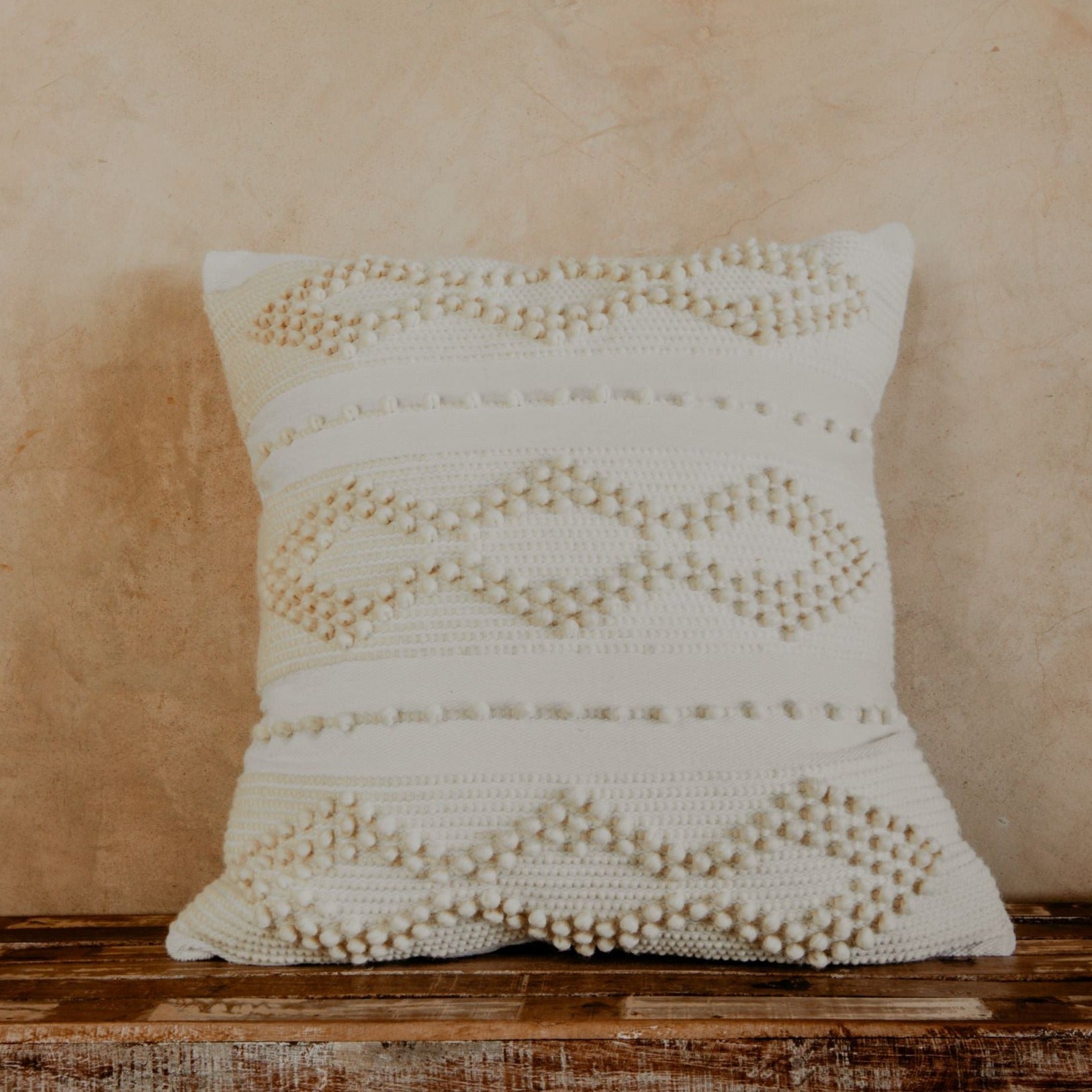 Prepare to fall in love with this compact accent pillow. A handwoven texture, a soft, neutral glow, and the coziness of premium cotton will make your bed, sofa or chair feel richer and more comfortable. 