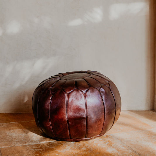 Hand stitched with premium leather, this Moroccan brown pouf is an essential piece in a contemporary or bohemian space.