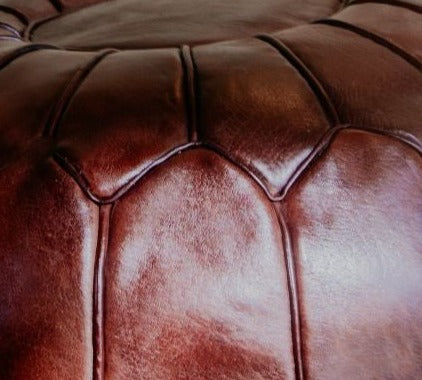 Hand stitched with premium leather, this Moroccan brown pouf is an essential piece in a contemporary or bohemian space.