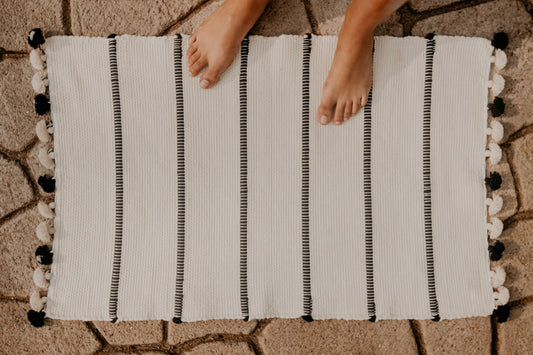 Hand-loomed using premium cotton, this highly absorbent and super soft bath rug will turn up the Boho vibes of your bathroom.
