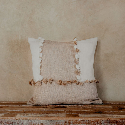 Pillows with blended textures in neutral tones like ivory and taupe are a nice way to make your space feel effortlessly chic. The tassels further add a playful personality to your sofa, bed, or armchair. 